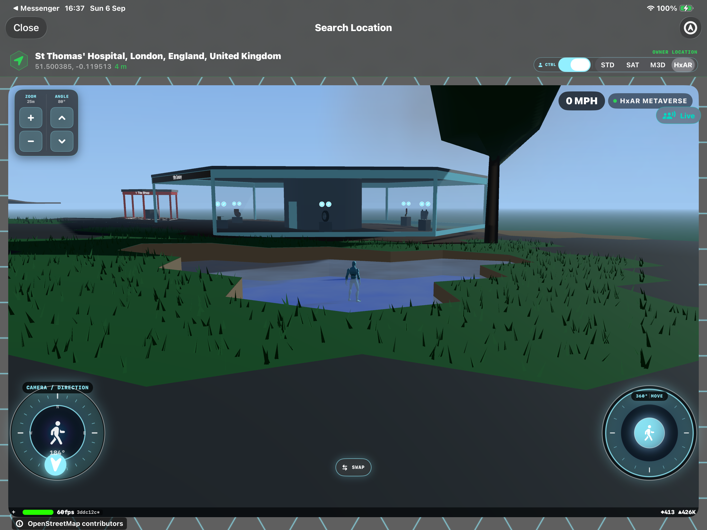 HxAR 2.1 Avatar standing in a blue inland water feature beside grass and virtual shops, with Zoom, Angle and movement controls visible.