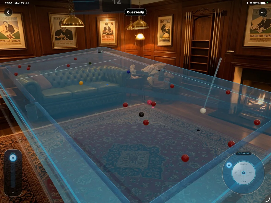 HxAR development preview showing a transparent virtual snooker table, coloured balls, a cue and cue-angle controls in a furnished room