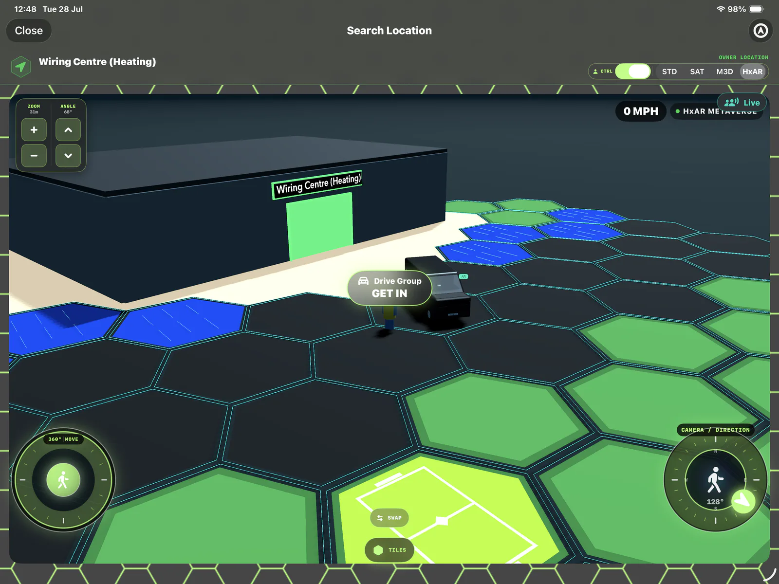 HxAR Metaverse property visit showing black Road, green Grass, blue Water and a lime Football Stadium HexTile beside a virtual building and van.