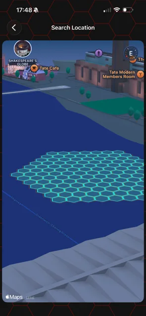 HxAR Search Location on iPhone showing a cyan local HexTile grid near public landmarks.