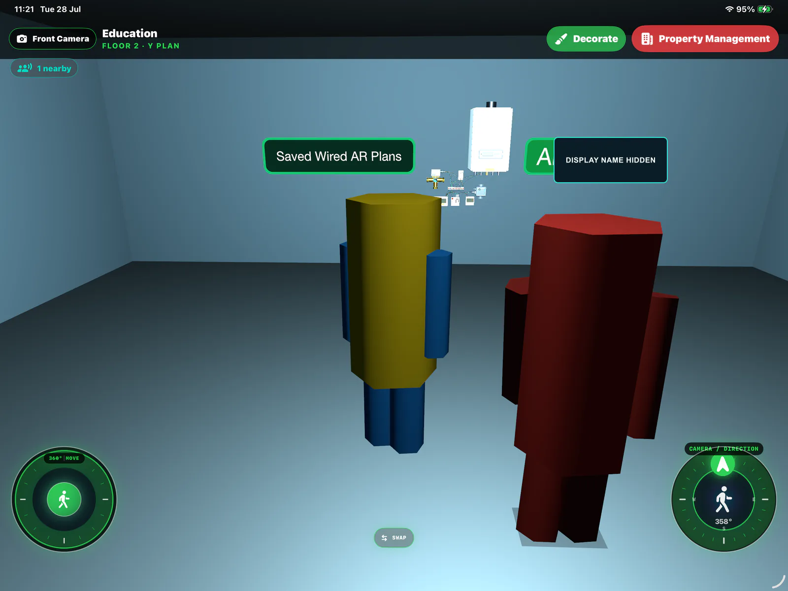 HxAR VR Building room with two avatars, a Saved Wired AR Plans exhibit and walking controls; the remote display name is hidden.