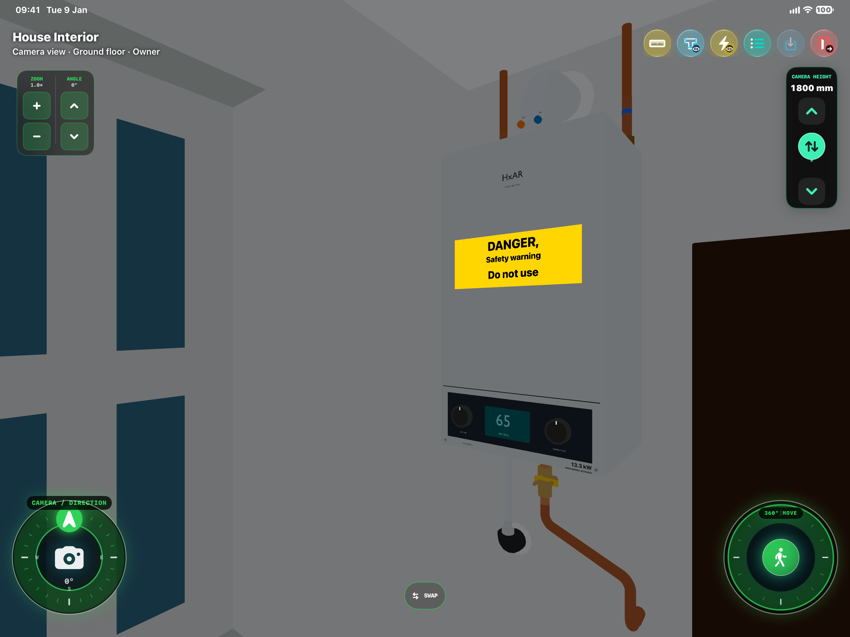 HxAR House Interior showing a wall-mounted virtual gas boiler, pipe connections and a yellow DANGER Safety warning Do not use label, with plumbing and electricity visibility icons in the toolbar.