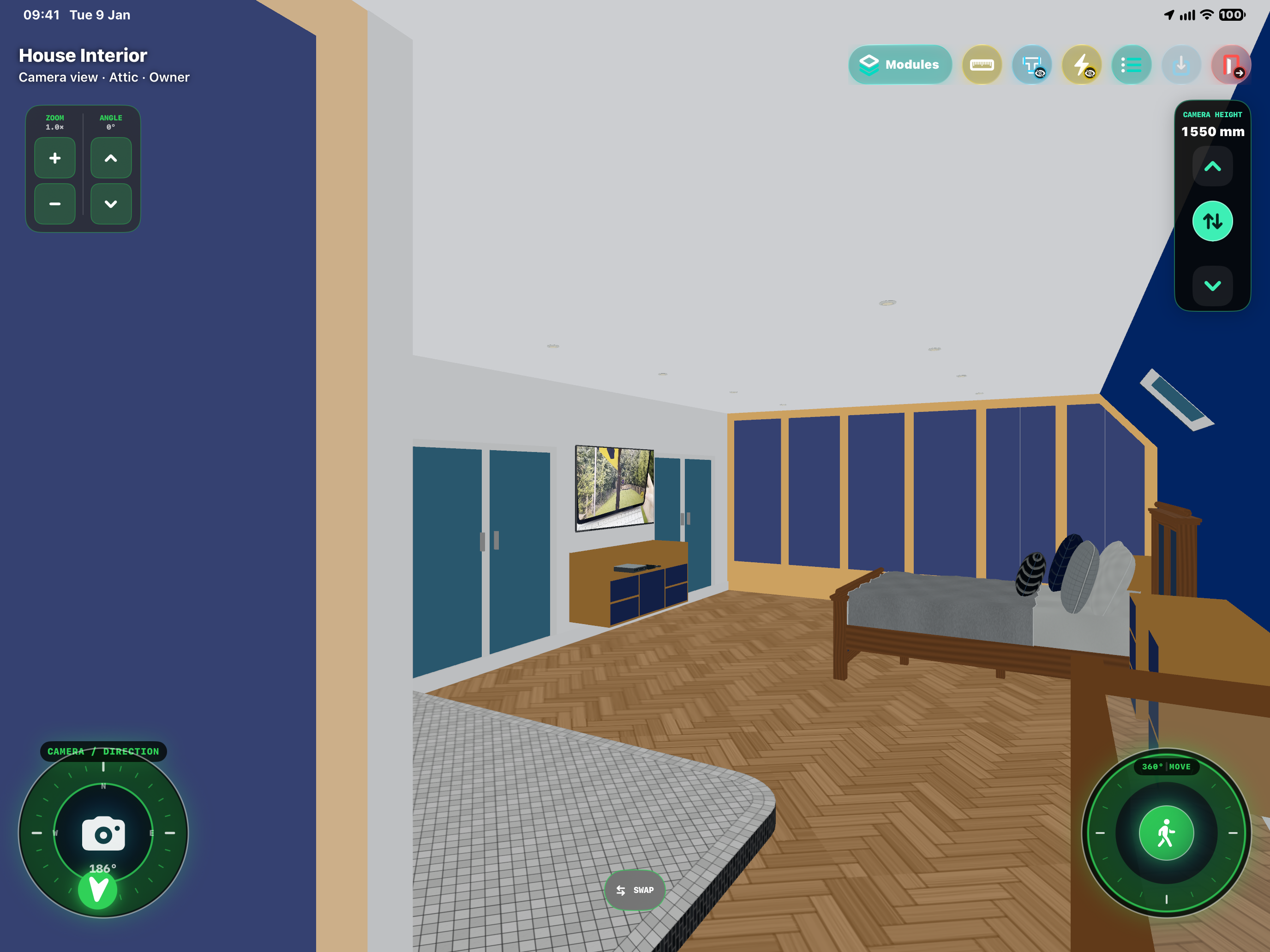 HxAR House Interior in the attic, showing a furnished bedroom with an oak bed, cupboards, television, wood flooring and an adjoining tiled area; Modules and camera controls are visible.