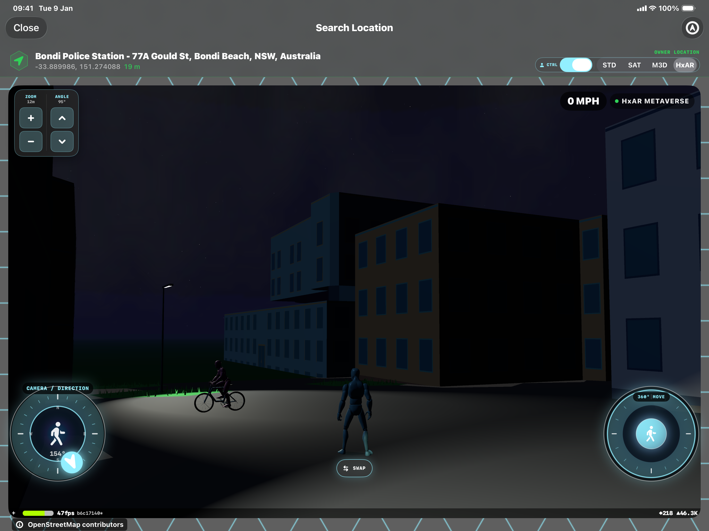 A lamppost illuminates the ground beside mapped buildings near Bondi Police Station in the HxAR Metaverse at night, with an avatar and a cyclist nearby.